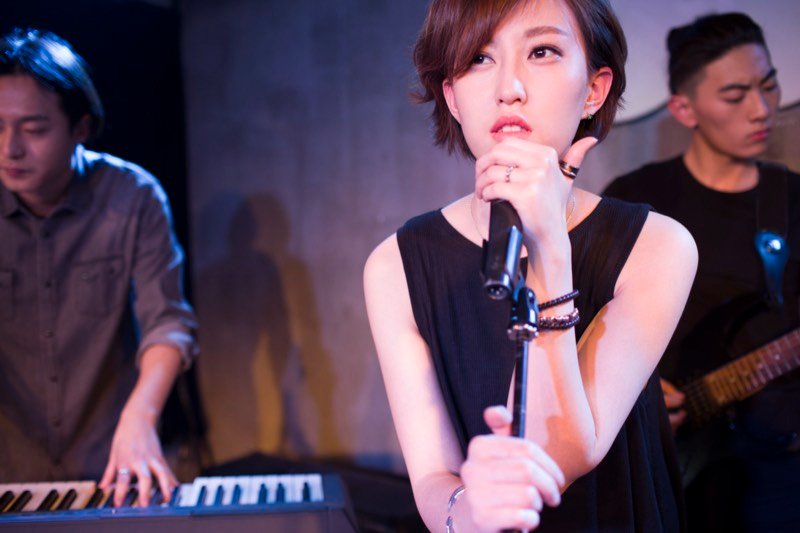 Independent musician performing at a small venue